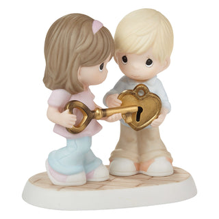 Precious Moments: Couple Holding Heart Lock Figurine sparkle-castle