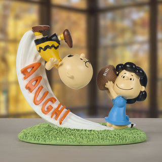 Precious Moments Peanuts: Lucy Pulling Football From Charlie Brown's Kick Figurine