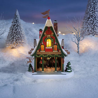 Department 56 North Pole Series: 50th Reindeer Acres Stable sparkle-castle