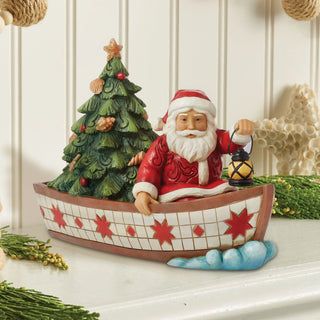 Jim Shore Heartwood Creek: Santa in Boat With Tree Figurine sparkle-castle