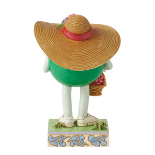 Jim Shore M&M'S: Green M&M With Easter Hat and Basket Figurine sparkle-castle