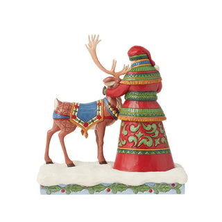 Jim Shore Heartwood Creek: 17th Annual Laplander Santa Standing With Reindeer Figurine sparkle-castle