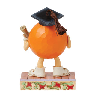 Jim Shore M&M'S: Orange M&M in Graduation Cap Figurine sparkle-castle