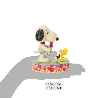Jim Shore Peanuts: Snoopy & Woodstock Exchanging Gifts Figurine sparkle-castle