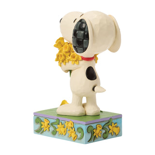 Jim Shore Peanuts: Snoopy With Bouquet of Daffodils Figurine sparkle-castle