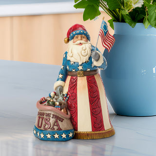 Jim Shore Heartwood Creek: Patriotic Santa With Flag Figurine sparkle-castle