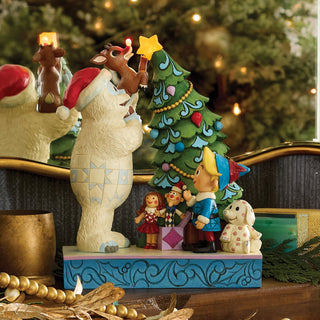 Jim Shore Rudolph Traditions: Bumble Holding Rudolph by Tree Figurine sparkle-castle