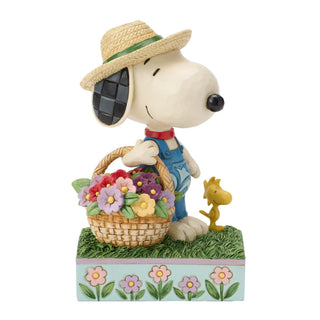 Jim Shore Peanuts: Snoopy Holding Flower Basket Figurine