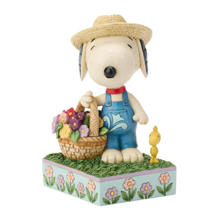Jim Shore Peanuts: Snoopy Holding Flower Basket Figurine
