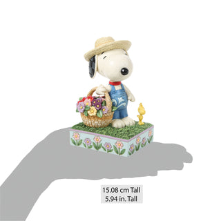 Jim Shore Peanuts: Snoopy Holding Flower Basket Figurine sparkle-castle