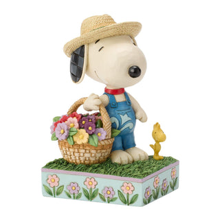 Jim Shore Peanuts: Snoopy Holding Flower Basket Figurine