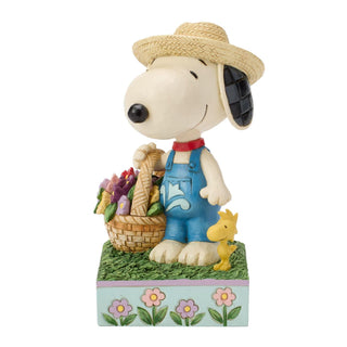 Jim Shore Peanuts: Snoopy Holding Flower Basket Figurine