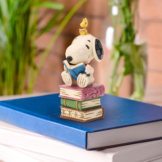 Jim Shore Peanuts: Snoopy Reading on Stacked Book Figurine sparkle-castle