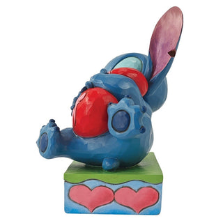 Jim Shore Disney Traditions: Stitch Hugging Heart Figurine sparkle-castle