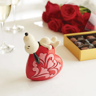Jim Shore Peanuts: Snoopy Laying On Heart Figurine sparkle-castle