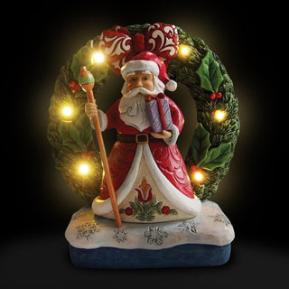 Jim Shore Heartwood Creek: Santa by Light Up Wreath Figurine sparkle-castle