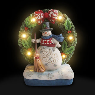 Jim Shore Heartwood Creek: Snowman by Light Up Wreath Figurine sparkle-castle