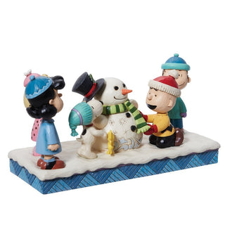 Jim Shore Peanuts: Peanuts Gang Building A Snowman Figurine sparkle-castle